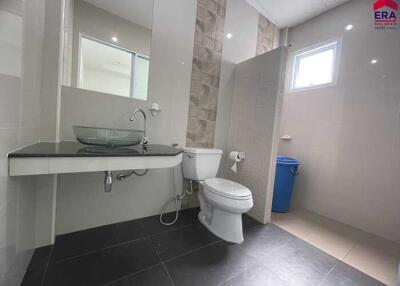 modern bathroom with glass sink and walk-in shower