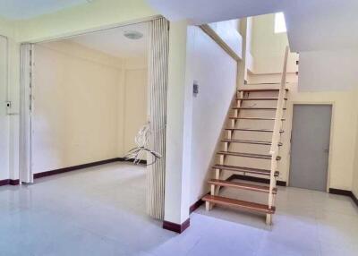 Bright and spacious main living area with staircase