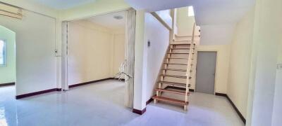 Bright and spacious main living area with staircase