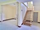 Bright and spacious main living area with staircase