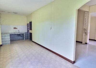 Spacious kitchen area with adjacent hallway