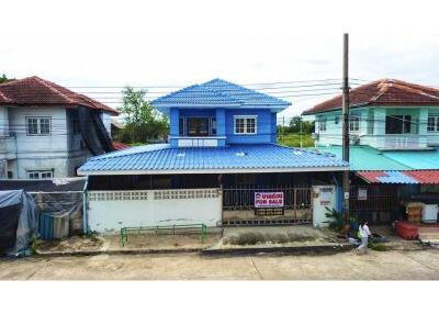 Two-story blue house available for sale