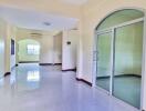 Spacious bright corridor with large windows and glass door