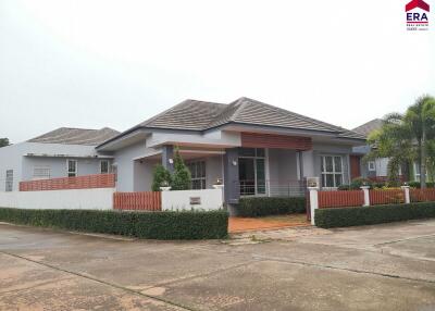 Front view of a modern single-story house with a landscaped yard