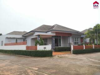 Front view of a modern single-story house with a landscaped yard