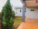 Outdoor area with garden and tiled patio