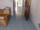 hallway with tiled floor and wooden door