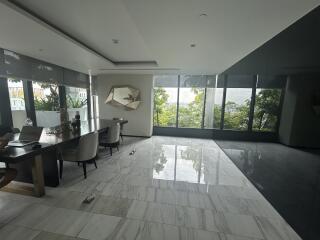 modern living room with marble flooring and large windows