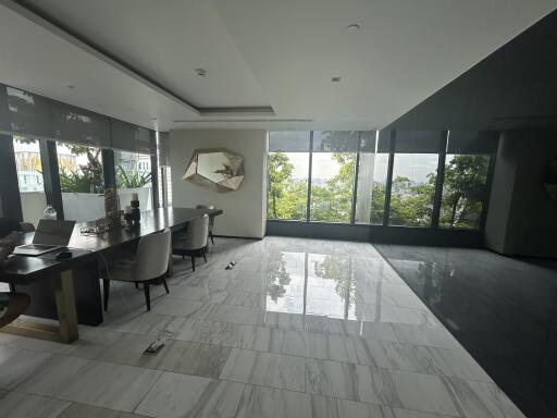 modern living room with marble flooring and large windows