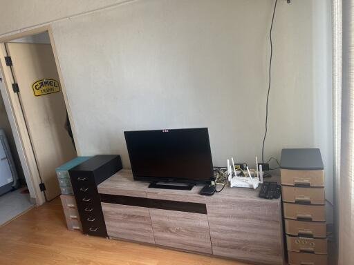 Living room entertainment setup with TV and storage drawers