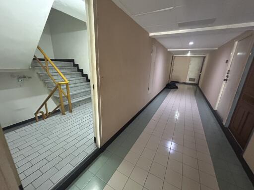 Apartment building hallway with stairs