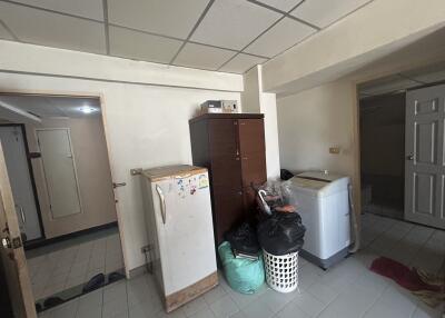 Laundry room with storage cabinet and washing machine