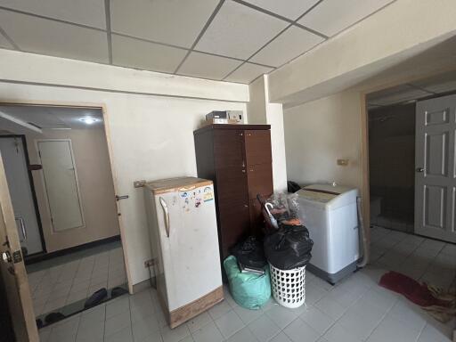 Laundry room with storage cabinet and washing machine