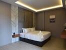 Modern bedroom with accent wall and lighting