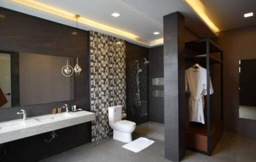 Modern bathroom with large mirror and walk-in shower