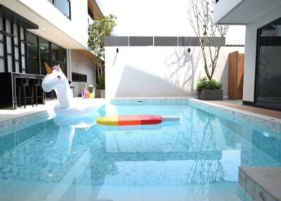 Outdoor pool area with floaties