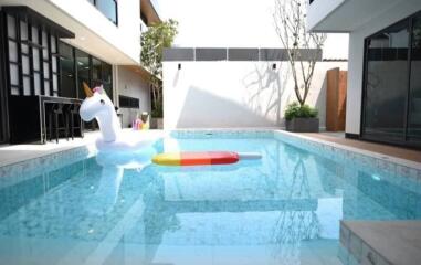 Outdoor pool area with floaties