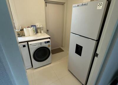 Laundry room with washer, dryer, and refrigerator