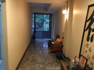 hallway with marble floor and wall decorations