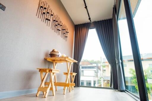 Dining area with modern decor and large windows