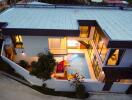 Aerial view of modern two-story house with indoor swimming pool