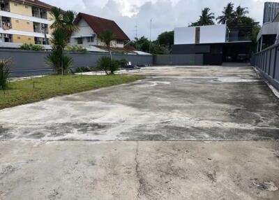 Spacious outdoor driveway with surrounding buildings