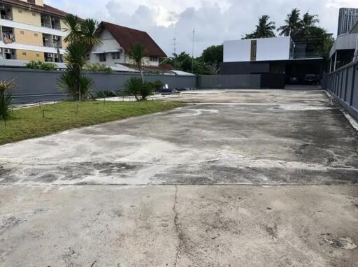 Spacious outdoor driveway with surrounding buildings