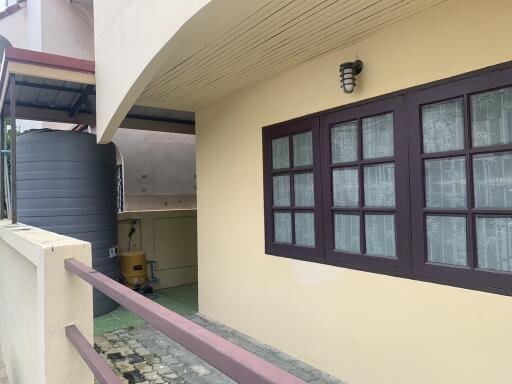 View of the building exterior with windows and a water tank