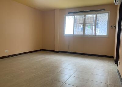 Spacious empty living room with large window