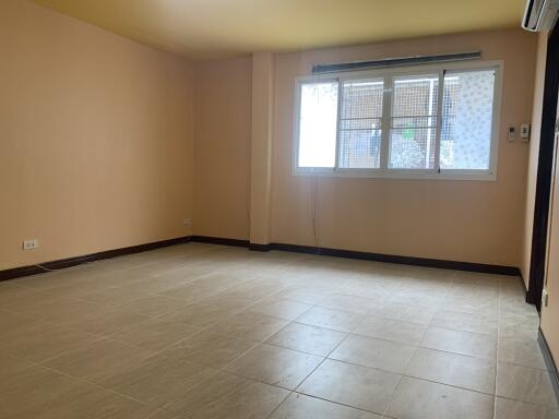 Spacious empty living room with large window