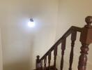 Wooden staircase with light fixture