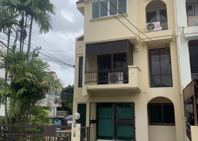 Exterior view of a three-story townhouse