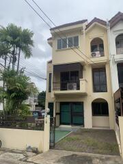 Exterior view of a three-story townhouse