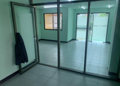 Empty living area with glass partition wall