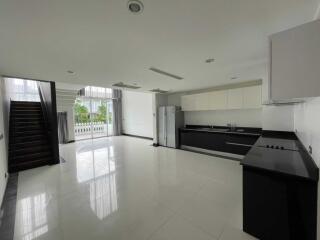 Modern kitchen with adjacent dining area in a spacious property