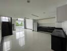 Modern kitchen with adjacent dining area in a spacious property