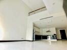 Modern kitchen and dining area with high ceilings