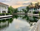 Scenic view of a pond surrounded by houses