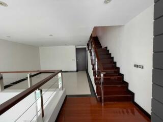 Modern Staircase with Wooden Steps and Glass Balustrade