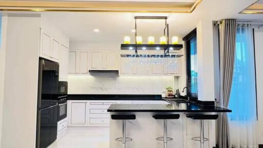 Modern kitchen with island and bar stools