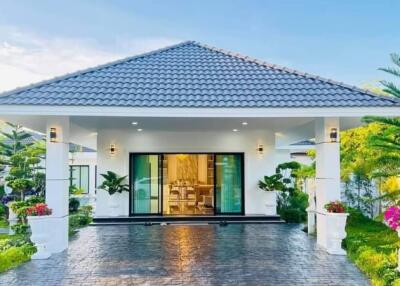 Modern house exterior with garden and driveway