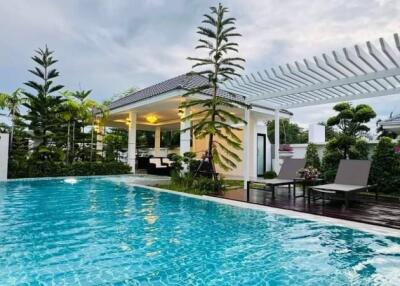 Beautiful outdoor area with swimming pool and pergola
