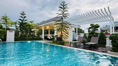 Beautiful outdoor area with swimming pool and pergola