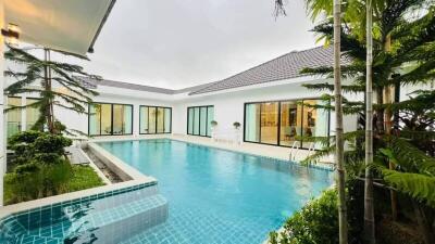 Luxury outdoor pool area with surrounding buildings