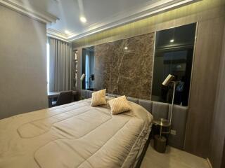 Modern bedroom with a large bed and stylish decor