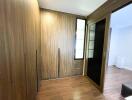 Bedroom with wooden closet and sliding doors