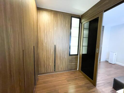 Bedroom with wooden closet and sliding doors