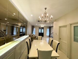 Elegant dining room with a large table and chandelier