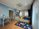 Spacious children's bedroom with study area and space-themed decor