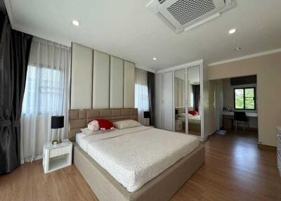 Spacious bedroom with modern furniture